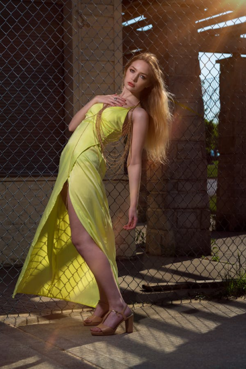 free-photo-of-blonde-woman-posing-n-yellow-dress-1