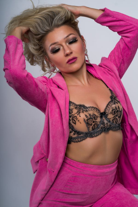 free-photo-of-woman-in-pink-jacket-and-bra-1